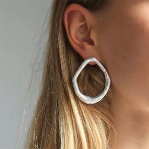 Silver irregular geometric hoop style earrings